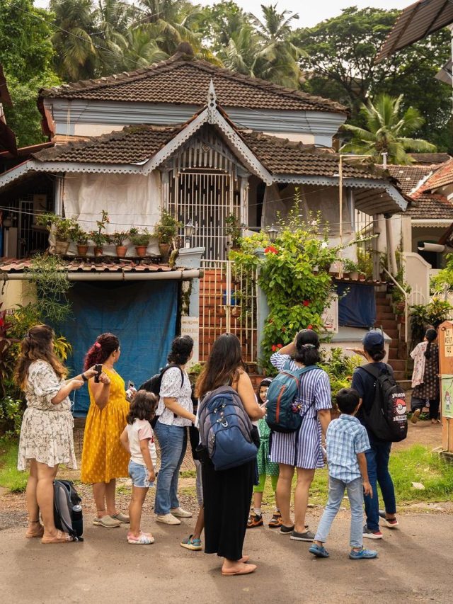 The image shows a group of tourist in an offbeat goan village