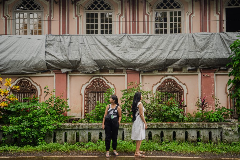 The image shows a walking trail in the village of Chandor Goa