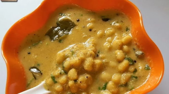 The image shows a Goan vegetarian dish Alsande Tonak