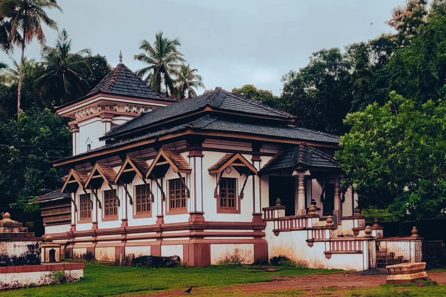 The image shows the famous Mallikarjun Temple in Goa