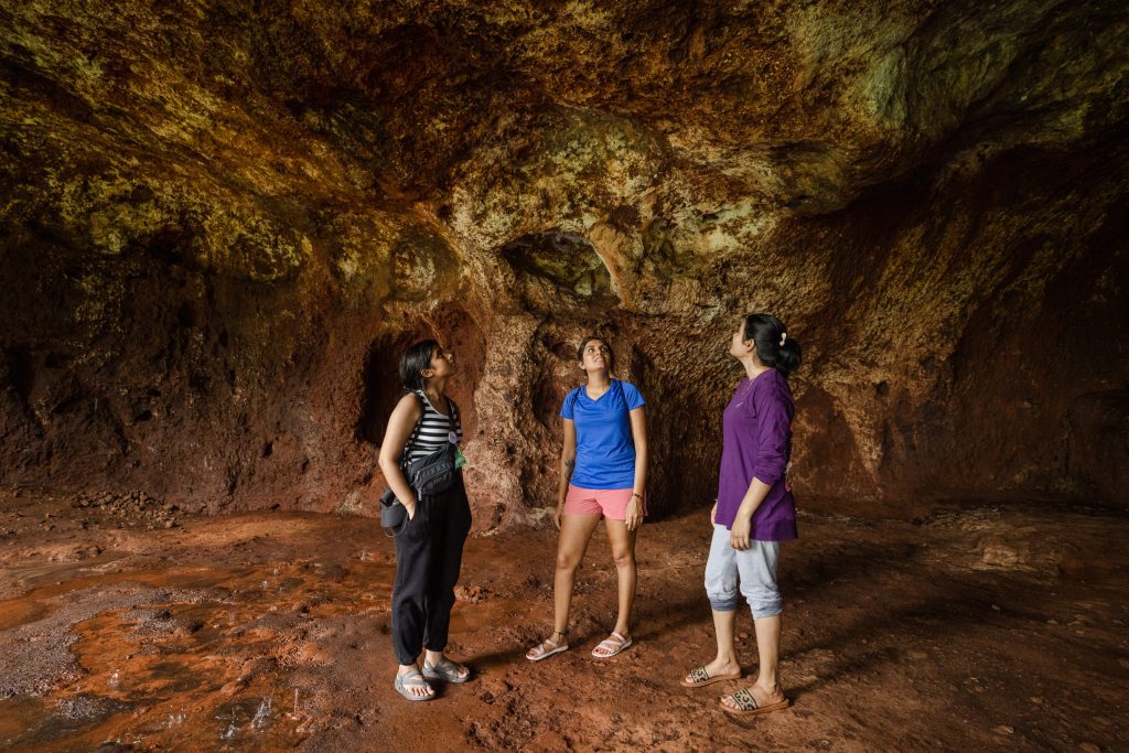 The image shows slow travelling by exploring the Buddhist caves of rivona