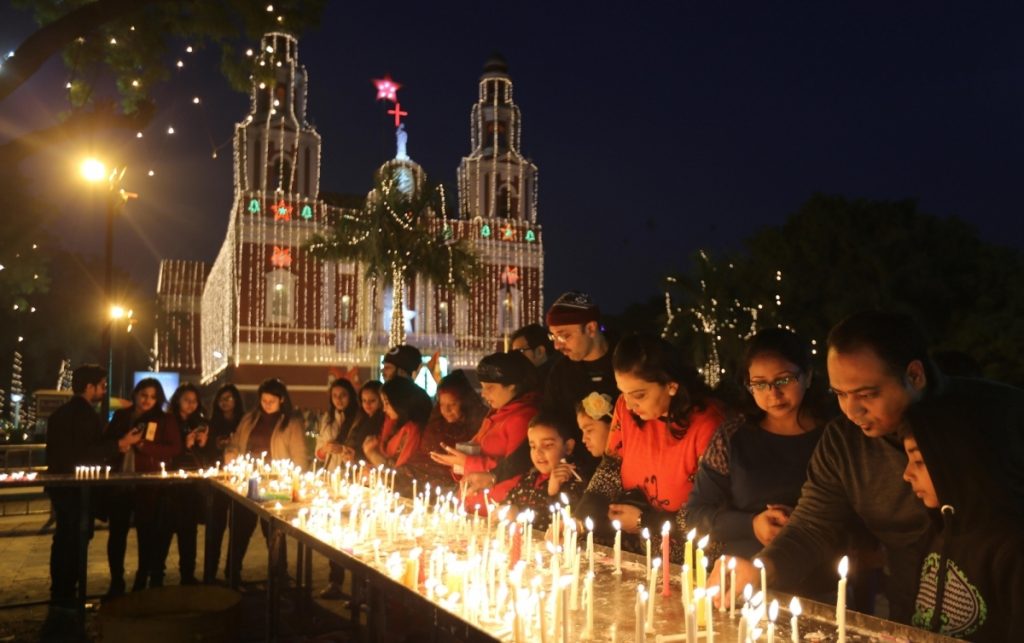 The image shows midnight mass for christmas in goa