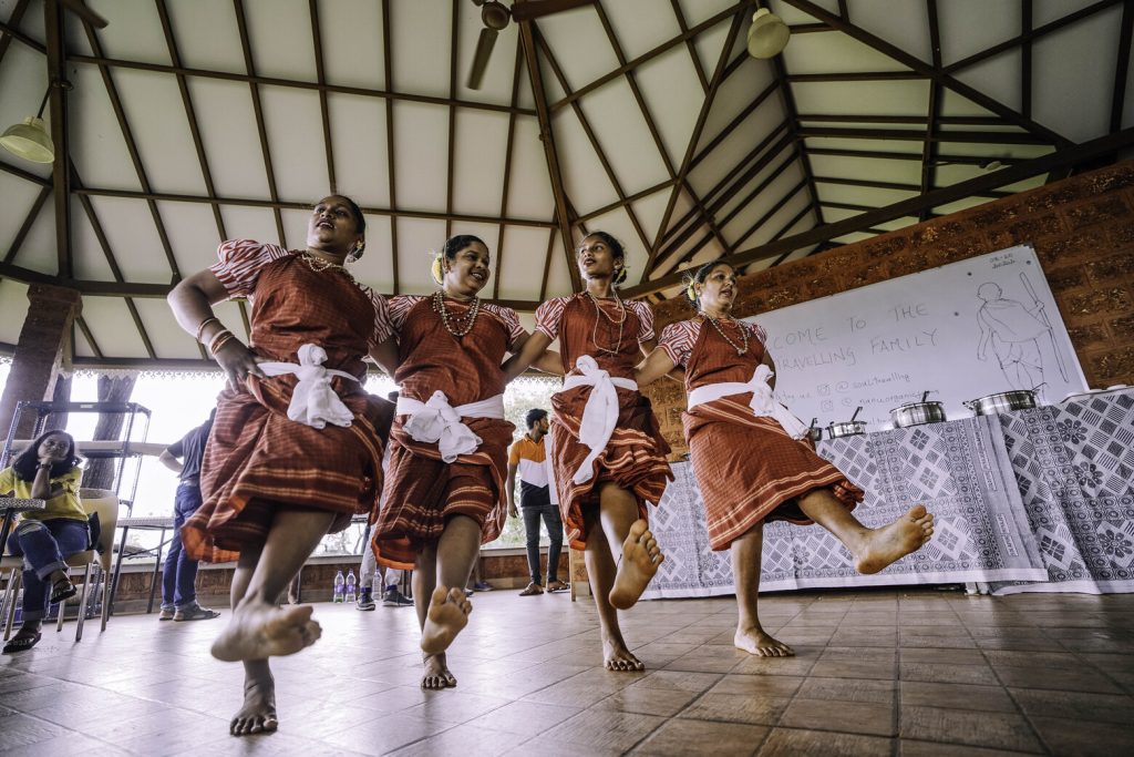 The image shows a cultural event kunbi dance in goa on a corporate team retreat in goa