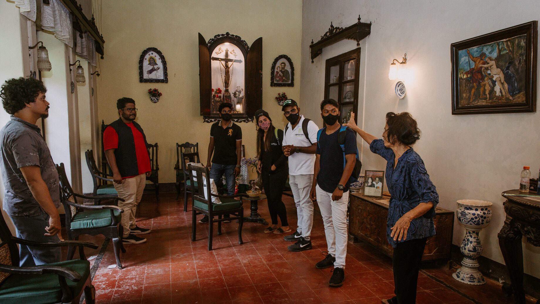 The image shows a family group of friends exploring the house of Goa