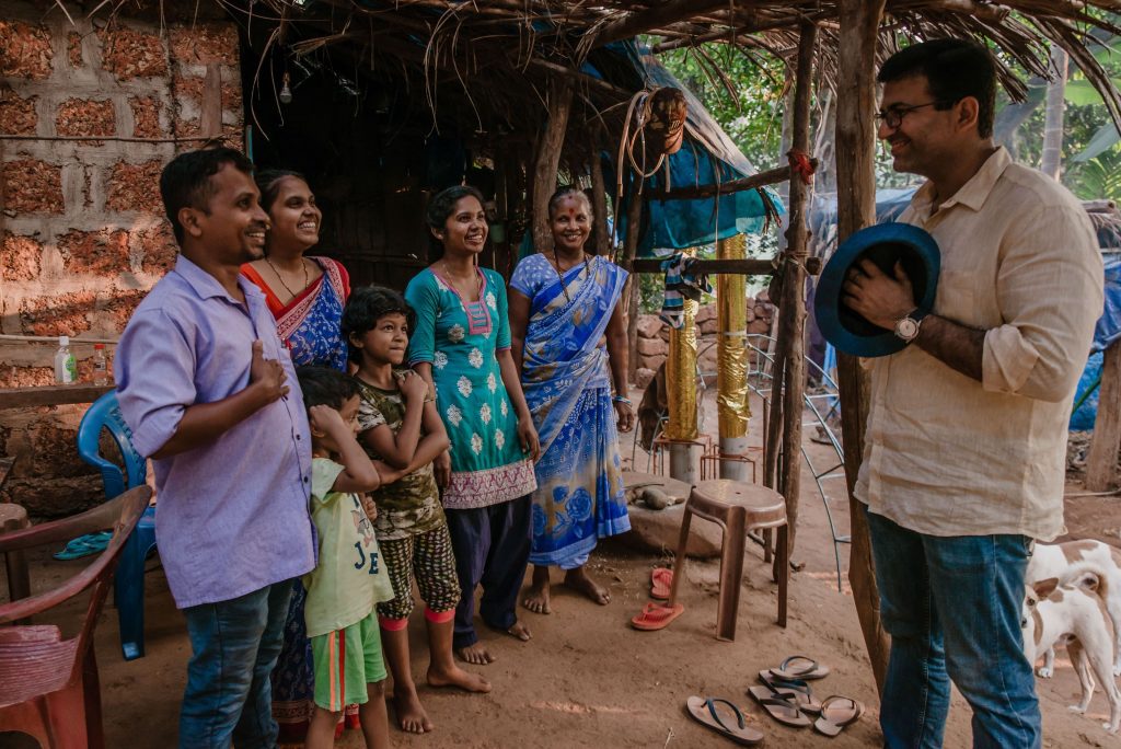 The image shows a tribal family in Goa